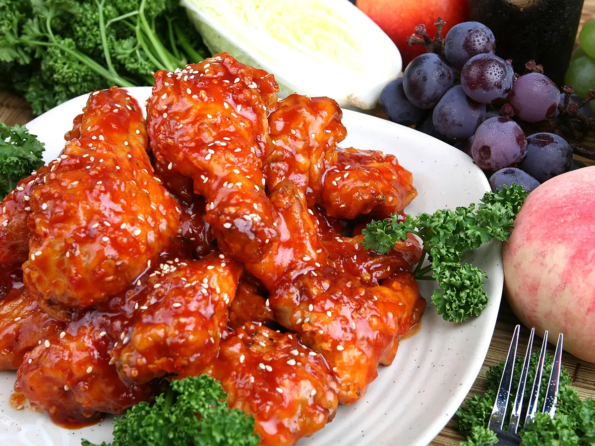 Glazed sweet-and-sour chicken wings topped with sesame seeds at Hong Yun Chinese Restaurant in Bayville